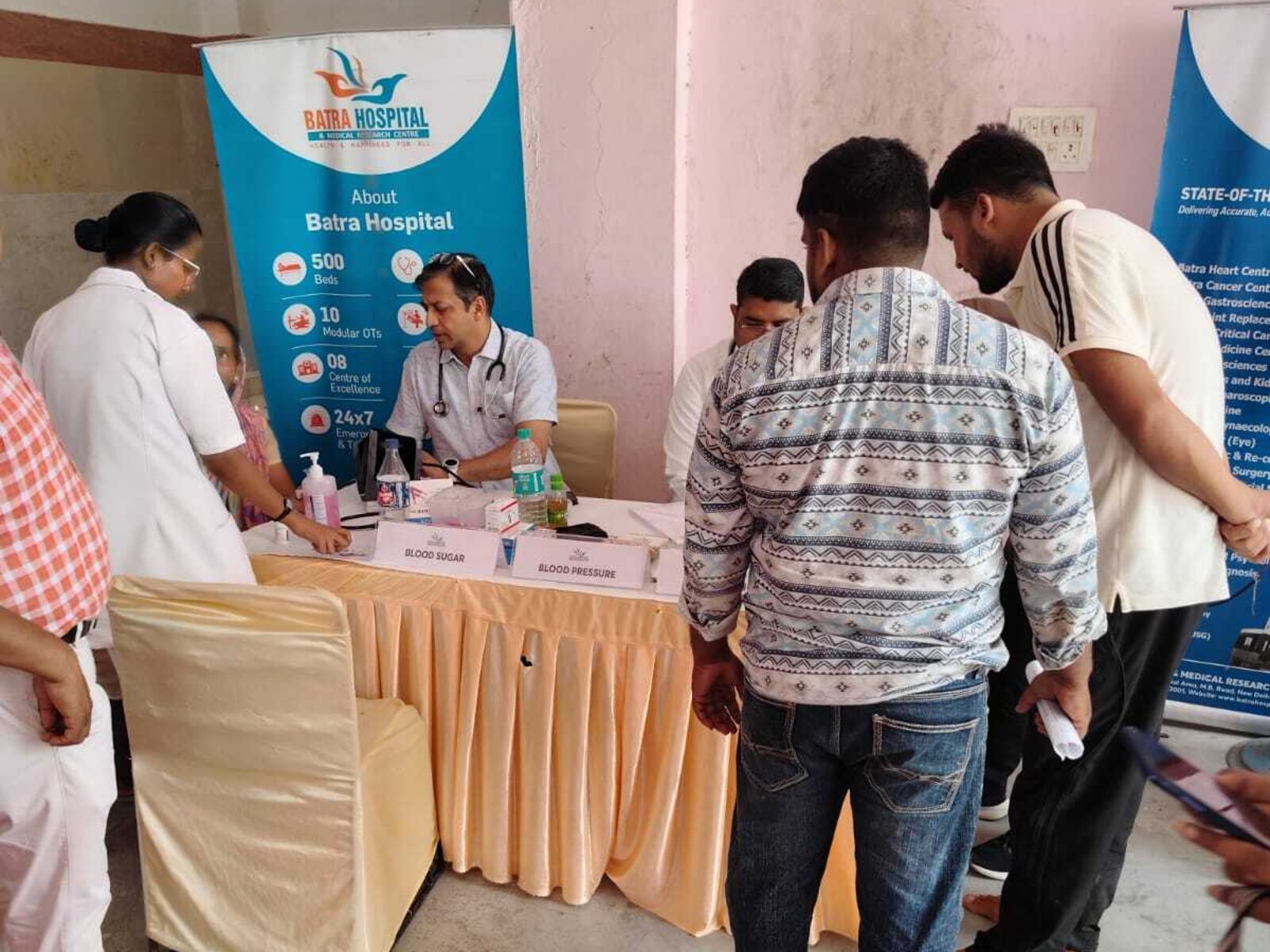 Blood pressure and blood sugar screening at a Batra Hospital community health camp